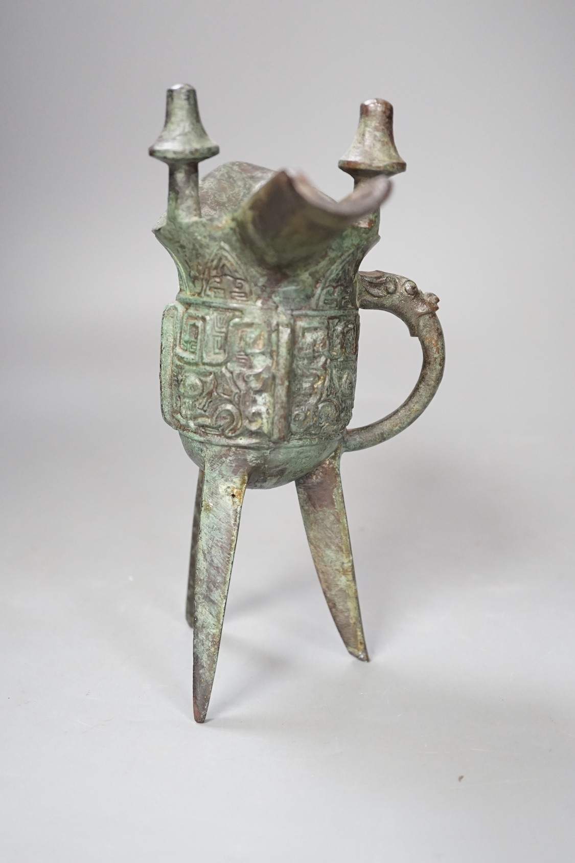 A Chinese jue archaistic bronze tripod vessel - 19.5cm tall
